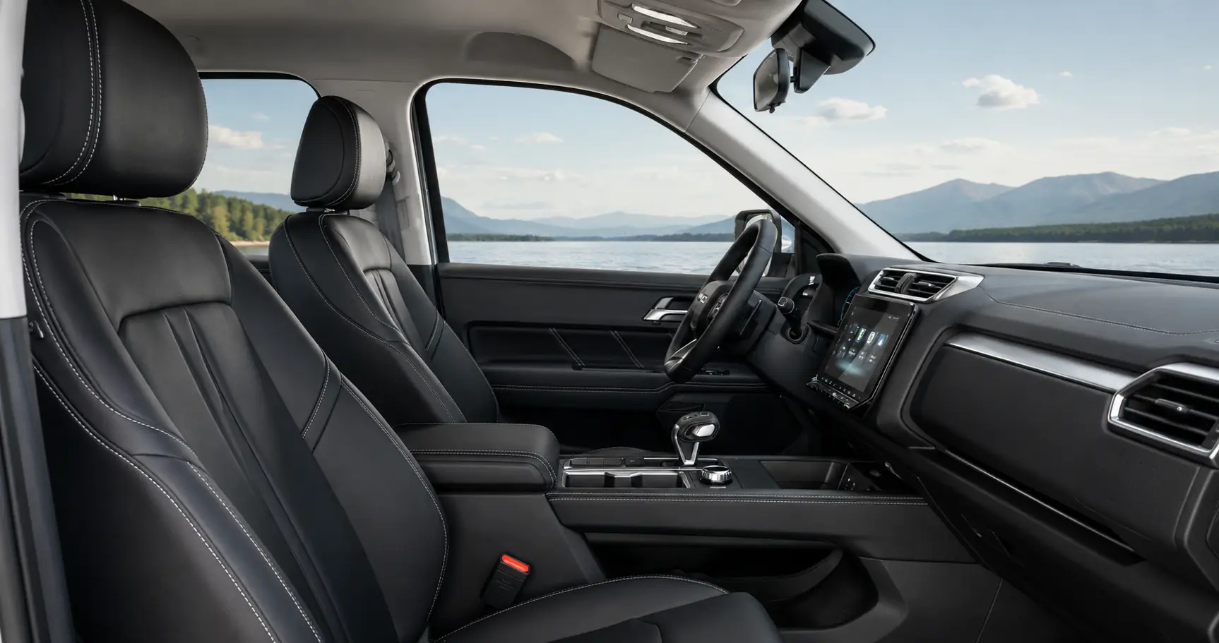 Cabine spacieuse du JMC Grand Avenue avec sièges avant, console et écran tactile
